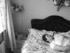 A fat lady is seen stroking her pussy on a camera concealed in the bedroom.